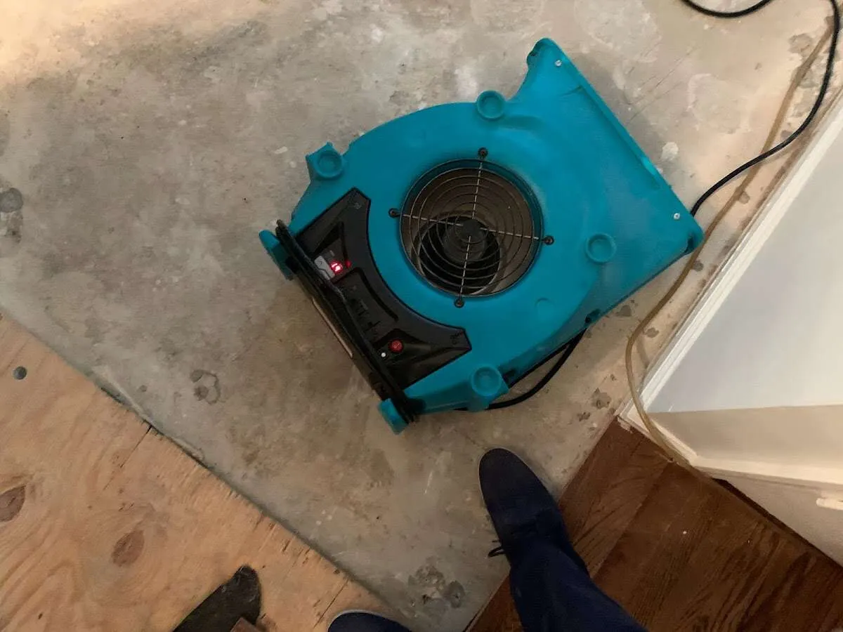 Air mover drying subfloor during Leak Detection & Repair in Wyandotte